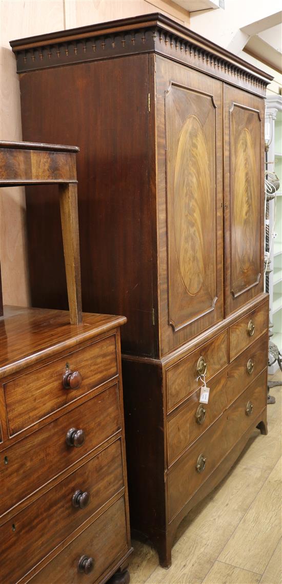 A George III inlaid mahogany linen press W.132cm